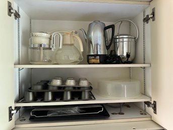 Three Shelves Of Kitchen And Bakeware