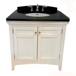 A Granite Top Vanity With Kohler Sink And  Polished Chrome Hardware