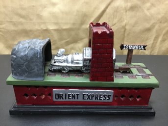 A Vintage Cast Iron Mechanical  Money Bank 'Orient Express'