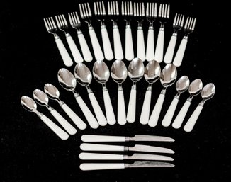 STAINLESS FLATWARE W/ WHITE PLASTIC HANDLES