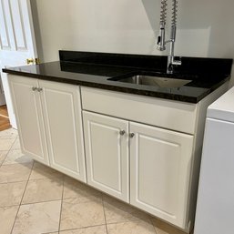 A 64' Kitchen Cabinet With Granite Top - Laundry Room