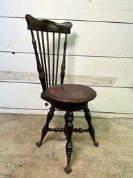 An Antique Highback Swivel Piano Stool With Glass Ball Brass Claw Feet