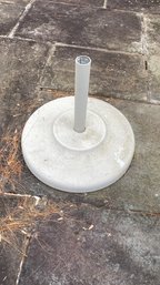 A White Metal And Concrete  Outdoor Umbrella Stand - 19' Diameter