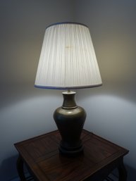 Classic Lamp With Tan Metal Base And Large Shade.
