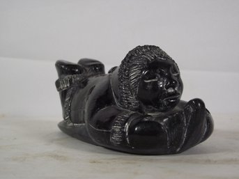 Eskimo Stone Sculpture Of Child On Sled