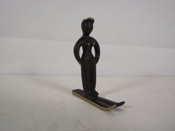 Small Bronze Sculpture Of Woman On Skis