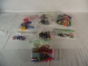 Lot Of Seven (7) Bags Of Plastic Toys