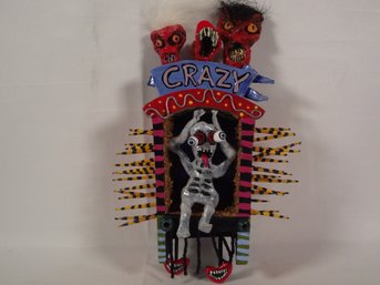 Strange Piece Of Artwork Titled Crazy - Brangi