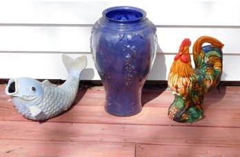 A Trio Of Yard Decorations Ceramic Koi Fish, Rooster And A Big Blue Glass Vase