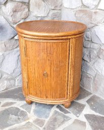 A Rattan Wicker One Door Drum Table