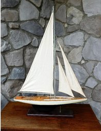 An Elegant Sailing Or Racing Yacht Boat Model On Stand