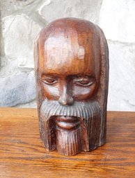 A Tribal Bust Hand Carved From A Block Of Wood