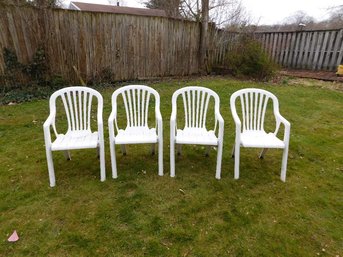 A Set Of 4 Heavy Vinyl/Plastic Lawn Chairs