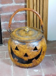 A Metal Jack-O-Lantern With Lid