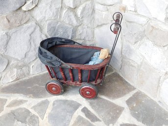 A Contemporary Child's Doll Carriage With Country Rag Doll