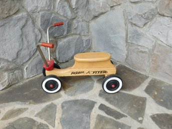 A Toddlers Radio Flyer Chopper Bike Style Wooden Scooter