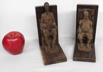 A Pair Of Carved Figural Wooden Bookends