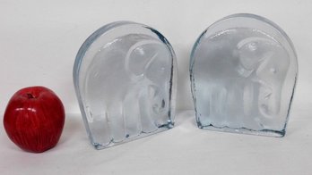 A Pair Of Pressed Elephant Glass Bookends In A Bluish Tone