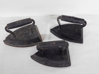 A Set Of Star Embossed Cast Iron Sad-irons Or Now - Doorstops, In 6, 7 And 8 Pound Sizes, A Rare Set
