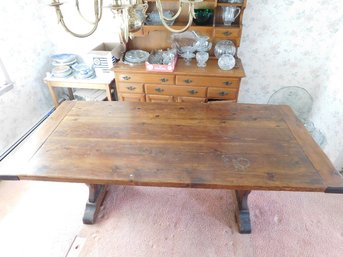 A Large Knotty Pine Trestle Dining Table