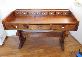A Large Knotty Pine Trestle Desk With Glass Top/insert