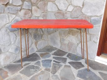 A Rustic Red Painted Table With Tall Hairpin Legs - Good Plant Table For The Porch