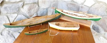 A Table Lot Of 4 Wooden Boat Models, A Sailboat Of Sorts, Canoes, Etc.
