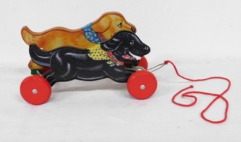 A Vintage Schylling Racing / Running Dogs Wooden Pull Toy With Bell