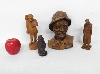 A Group Of Carved Wooden Figures & Faces