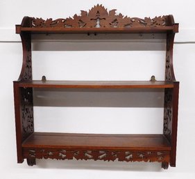 A Finely Carved Open Fretwork Victorian Style Hardwood Shelf