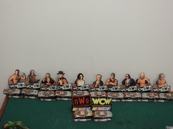 Lot Of 12 WCW NWO 1/64th Wrestling Cars With Stands