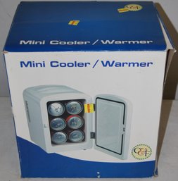 New In Box Mini Cooler/warmer