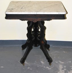 Antique Marble Top Parlor Table With Hand Carved Accents.
