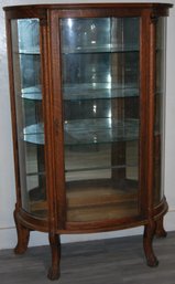 Beautiful Antique Curved Glass Tiger Oak And Mirrored Back Curio Cabinet With Gargoyle Faces And Claw Feet