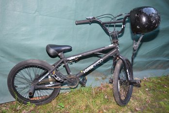 Black Hyper  Bike Co. Boom Spinner Pro Model Youth Bicycle With 19in Wheels And A Medium Youth Bike Helmet