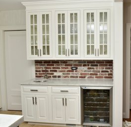 Custom Wood Kitchen Cabinets With Carrera Marble Counter Top And Glass Upper Doors