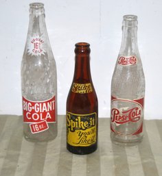 Three Vintage Soda Bottles