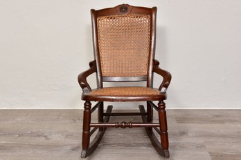 Child's Antique Wooden Rocking Chair With Cane Seat And Back