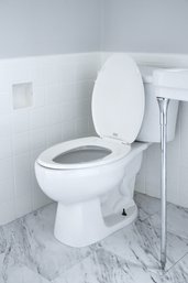 An American Standard 2 Piece Toilet - Bath 2B