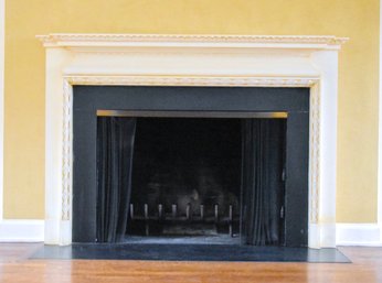 An Ornate Decorative Fireplace Surround And Mantel