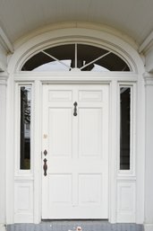 A Vintage Front Door With Transom Fan Light And Sidelights