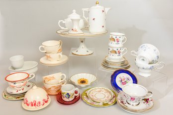 Collection Of Assorted China Tea Cups, Saucers, Tea Pots, Cake Plate, And More