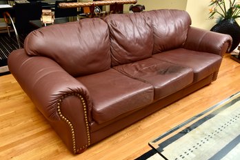 Leather Center Three Cushion Sofa With Studded Detail