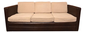 Mid-Century Three Cushion Faux Leather Sofa On Casters