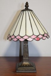 Tiffany Style Table Lamp With Creamy Colored Shade And Pink Edge Design