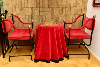 Pair Of Red Velvet Upholstered Chairs With Iron Base And Wood Accent Table With Red Velvet Tablecloth
