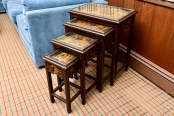 Set Of Four Chinese Wood Nesting Tables Carved In Deep Relief With Glass Tops