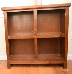 Cherry Colored Wood Four Cubby Bookshelf - Lot 1