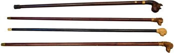 Collection Of Four Wooden Canes With Carved Dog Grips