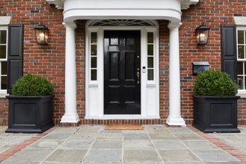 Pair Of Large Black Resin Panel Planters With Boxwood Hedge Shrub